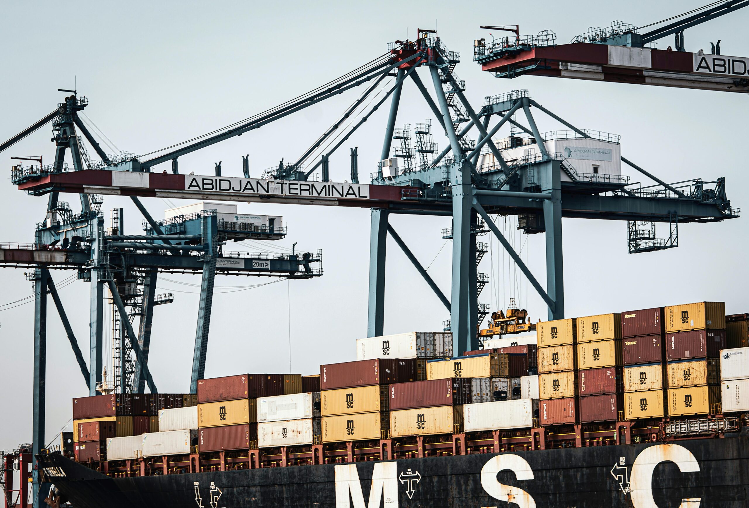 Cranes and Containers in Harbor